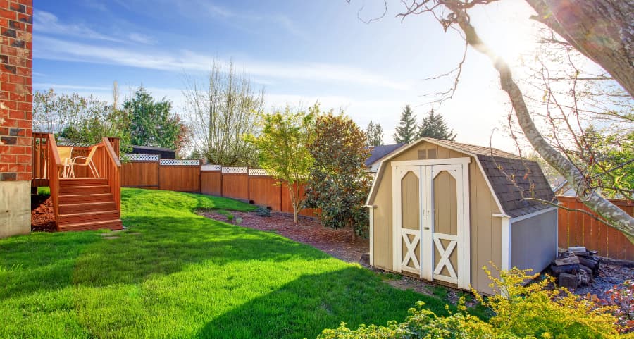 Fenced backyard with storage shed in West Palm Beach